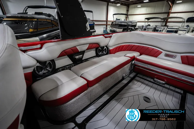 Slide: The Image of Interior of 2017 Malibu Wakesetter 25 LSV boat with red and white seating. - 33