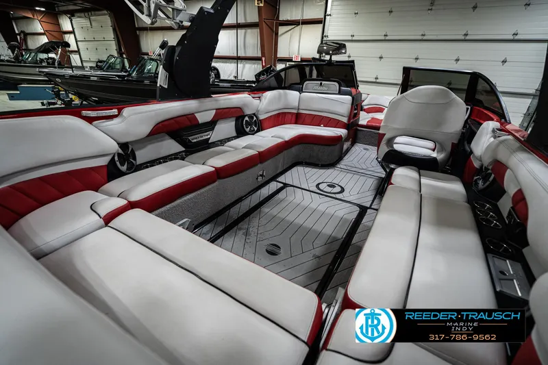Slide: The Image of Luxurious interior of a 2017 Malibu Wakesetter 25 LSV boat with red and white seating. - 35