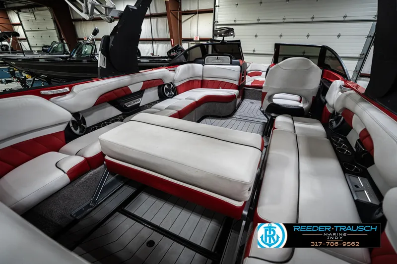 Slide: The Image of 2017 Malibu Wakesetter 25 LSV interior with red and white seating, spacious layout. - 36