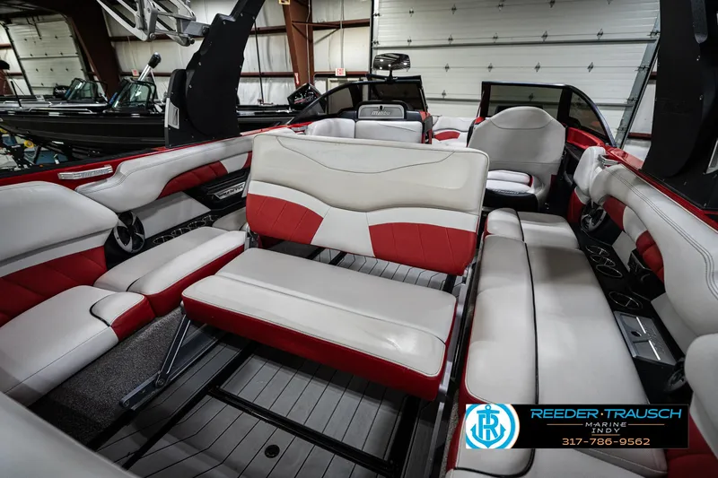Slide: The Image of Interior of 2017 Malibu Wakesetter 25 LSV boat with red and white seating. - 37