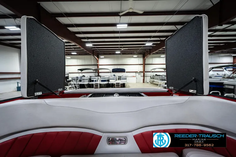 Slide: The Image of 2017 Malibu Wakesetter 25 LSV interior in showroom, featuring red and white seating. - 39