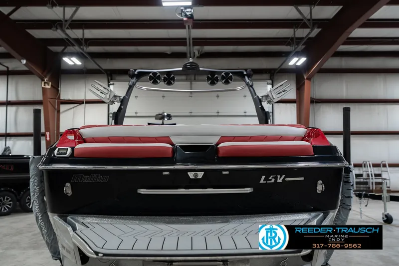 Slide: The Image of 2017 Malibu Wakesetter 25 LSV boat in a showroom, rear view. - 40