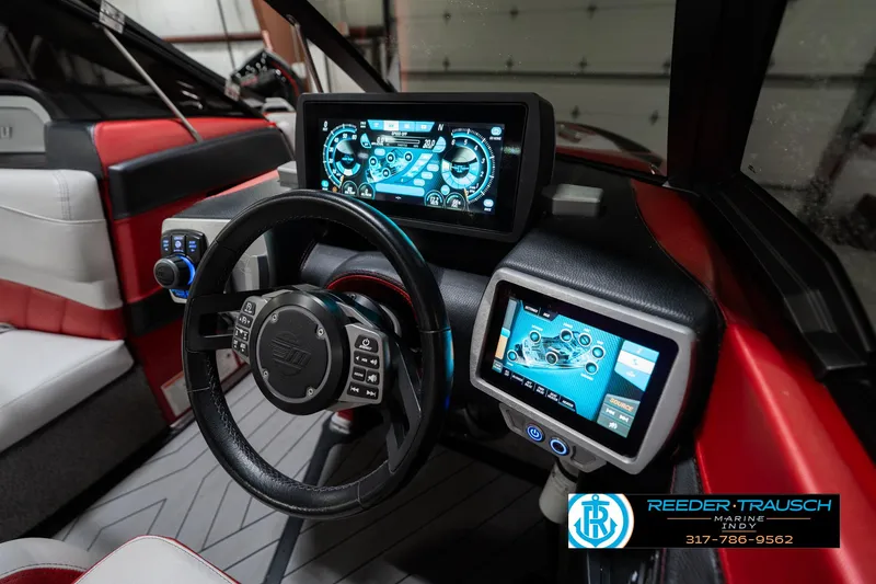 Slide: The Image of 2017 Malibu Wakesetter 25 LSV dashboard with advanced digital displays and controls. - 45