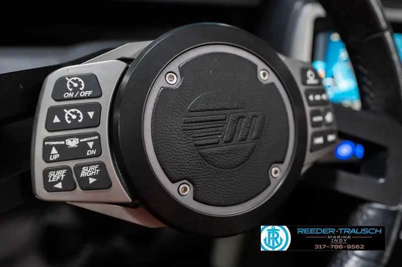 Slide: The Image of Steering wheel controls of a 2017 Malibu Wakesetter 25 LSV boat. - 46