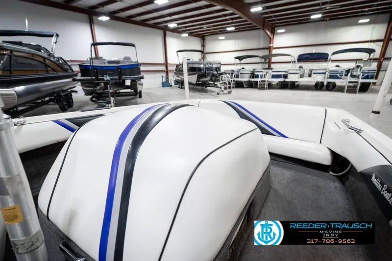 Slide: The Image of 1997 Malibu Response boat interior in showroom with other boats displayed. - 21