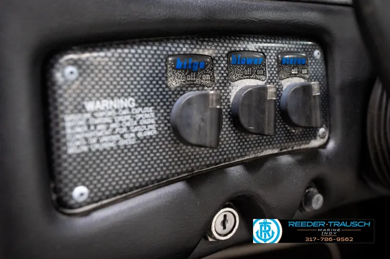 Slide: The Image of 1997 Malibu Response dashboard switches for bilge, blower, and stereo controls. - 29