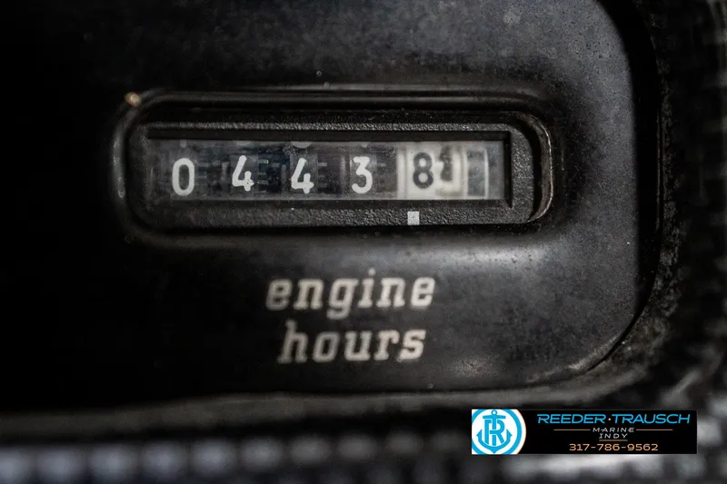Slide: The Image of 1997 Malibu Response engine hour meter displaying 443.8 hours, Reeder-Trausch Marine logo visible. - 32