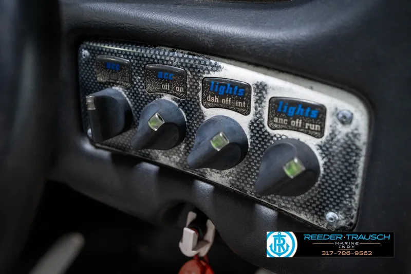 Slide: The Image of 1997 Malibu Response dashboard switches with labels for accessories and lights. - 33