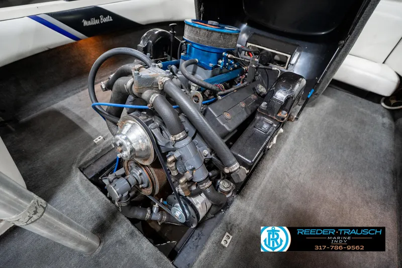 Slide: The Image of 1997 Malibu Response boat engine in detailed view, showcasing mechanical components. - 39