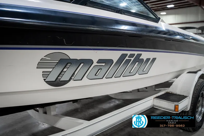 Slide: The Image of 1997 Malibu Response boat on trailer in indoor showroom. - 40
