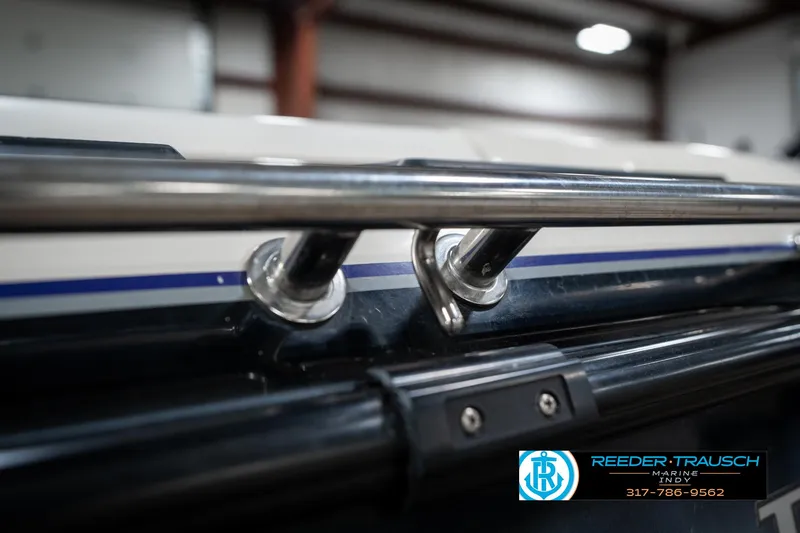 Slide: The Image of 1997 Malibu Response boat detail with stainless steel railings in a showroom. - 43