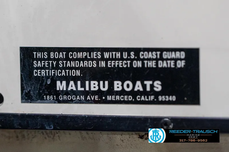 Slide: The Image of 1997 Malibu Response boat compliance label with U.S. Coast Guard safety standards. - 44