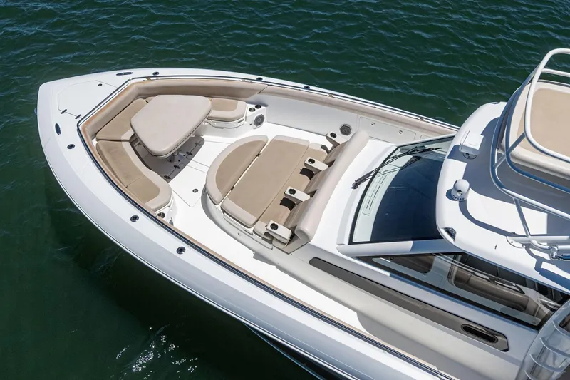 Slide: The Image of 2017 Boston Whaler 42 OUTRAGE boat with spacious seating on calm water. - 14