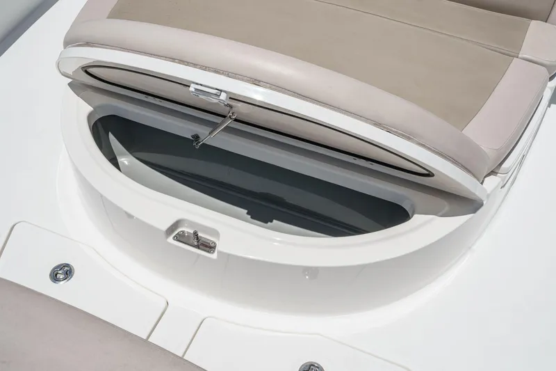 Slide: The Image of Open storage compartment on 2017 Boston Whaler 42 OUTRAGE boat seat. - 22