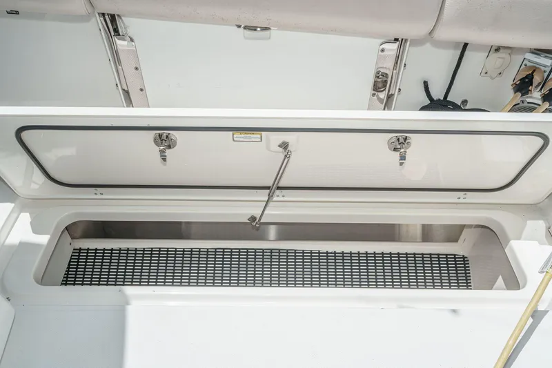 Slide: The Image of Storage compartment on a 2017 Boston Whaler 42 OUTRAGE boat, open and empty. - 30