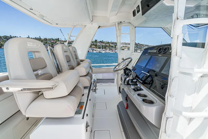 Slide: The Image of 2017 Boston Whaler 42 OUTRAGE helm with luxurious seating and advanced navigation systems. - 36