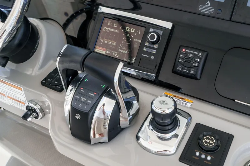Slide: The Image of Control panel of a 2017 Boston Whaler 42 OUTRAGE boat with advanced navigation systems. - 42