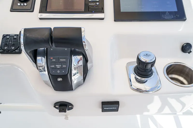 Slide: The Image of Control panel of a 2017 Boston Whaler 42 OUTRAGE boat with throttle and joystick. - 58