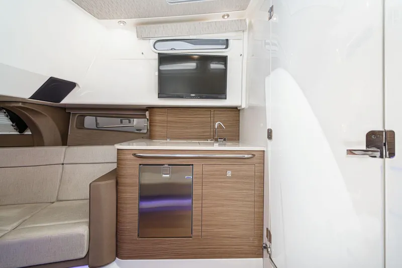 Slide: The Image of Luxurious interior of 2017 Boston Whaler 42 OUTRAGE with kitchenette and seating area. - 62