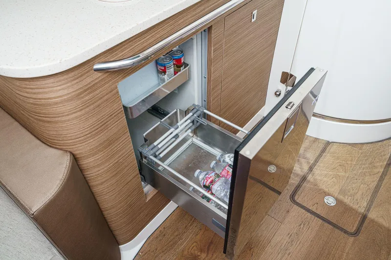 Slide: The Image of 2017 Boston Whaler 42 OUTRAGE interior with open drawer fridge, showcasing modern design. - 65