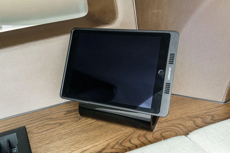 Slide: The Image of Tablet on wooden surface inside 2017 Boston Whaler 42 OUTRAGE boat interior. - 69