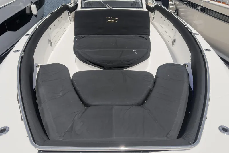 Slide: The Image of 2017 Boston Whaler 42 OUTRAGE boat with cushioned seating area. - 81