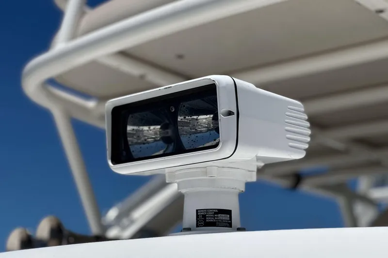 Slide: The Image of Remote control searchlight on 2017 Boston Whaler 42 OUTRAGE boat, under clear blue sky. - 82