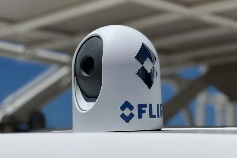 Slide: The Image of FLIR camera on 2017 Boston Whaler 42 OUTRAGE boat under clear blue sky. - 83