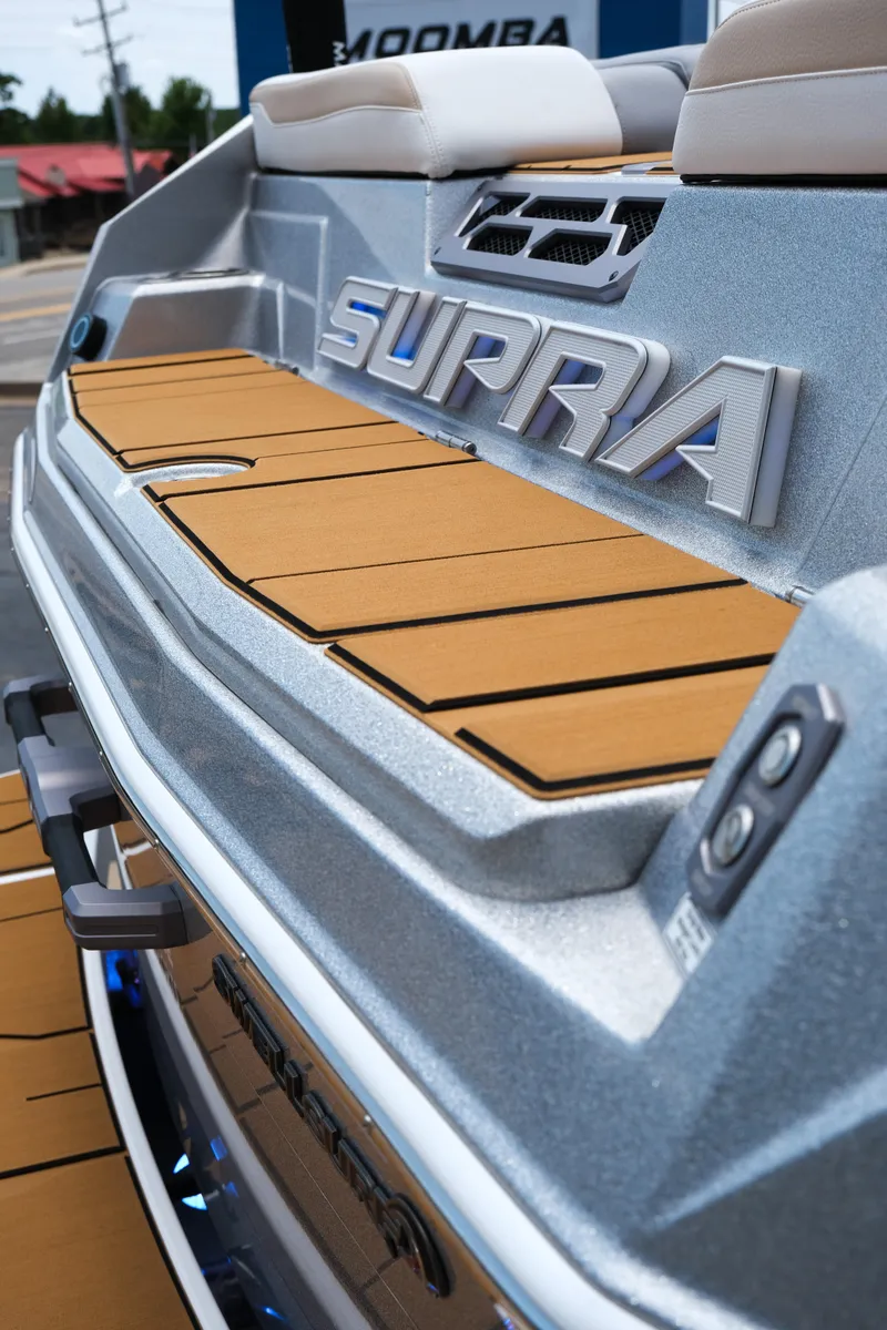 Slide: The Image of 2025 Supra SE450 boat with sleek design and modern detailing. - 13