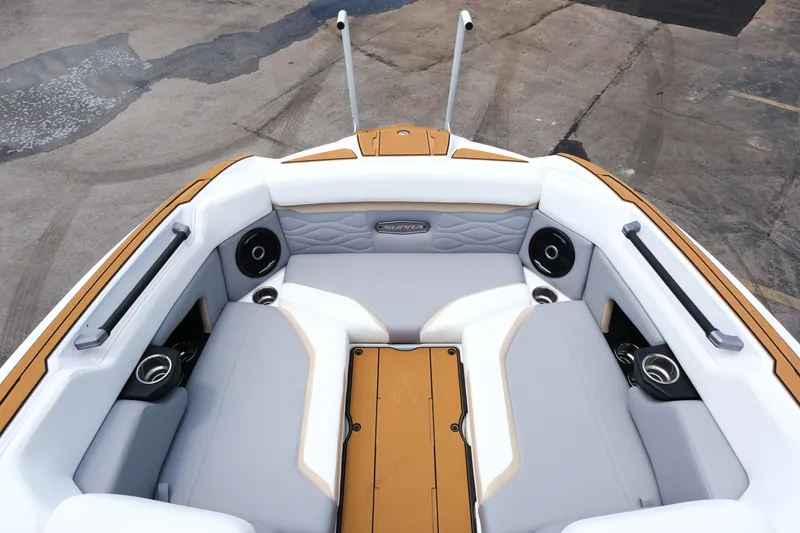 Slide: The Image of 2025 Supra SE450 boat interior with cushioned seating and built-in speakers. - 20