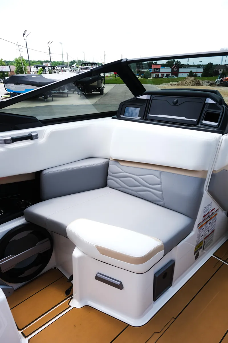 Slide: The Image of Interior of 2025 Supra SE450 boat with modern seating and dashboard design. - 21