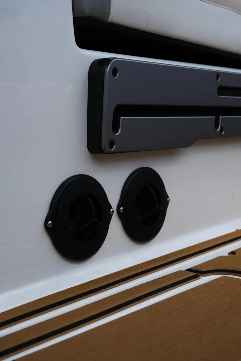 Slide: The Image of 2025 Supra SE450 boat interior detail with cup holders and sleek design elements. - 23