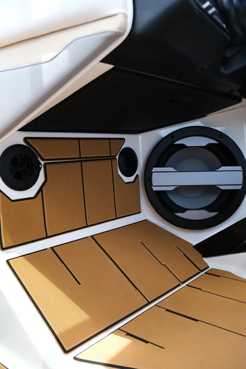Slide: The Image of 2025 Supra SE450 interior with premium sound system and stylish tan accents. - 24