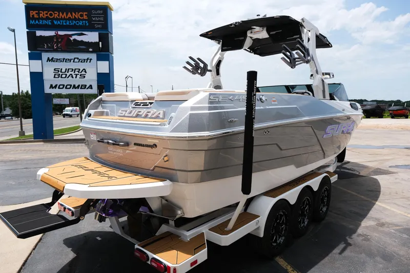 Slide: The Image of 2025 Supra SE450 boat at Performance Marine Watersports dealership, showcasing sleek design and features. - 7