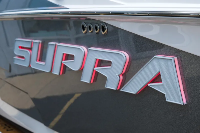 Slide: The Image of Close-up of 2025 Supra SE450 logo on boat exterior. - 9