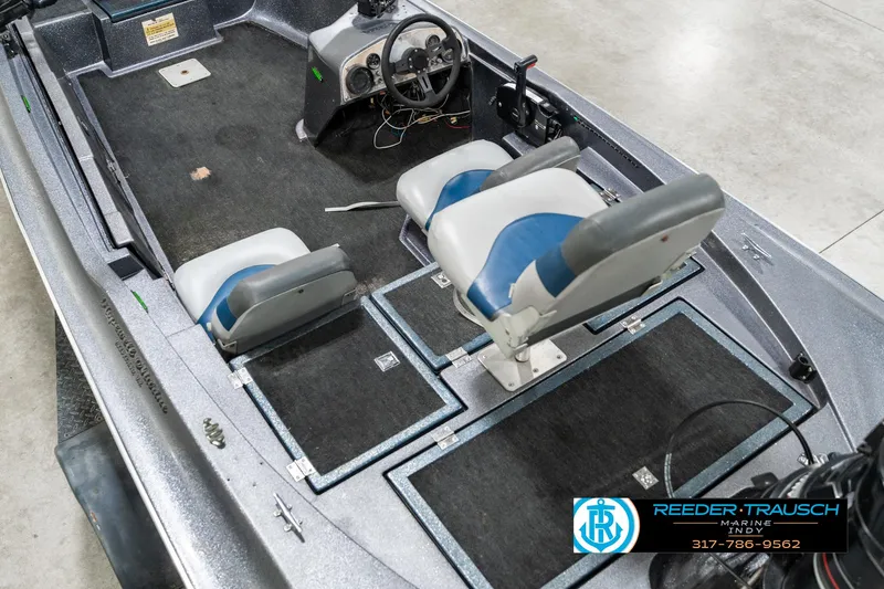 Slide: The Image of 1986 Phantom Panther boat interior with dual seats and steering console. - 13