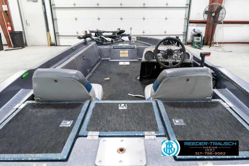 Slide: The Image of Interior of a 1986 Phantom Panther boat in a garage setting. - 14