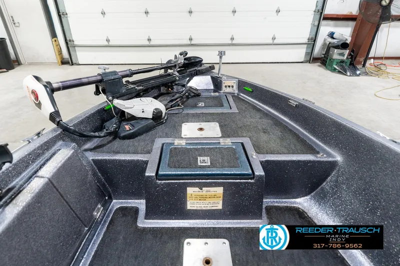 Slide: The Image of 1986 Phantom Panther boat interior with trolling motor, showcased at Reeder-Trausch Marine. - 16