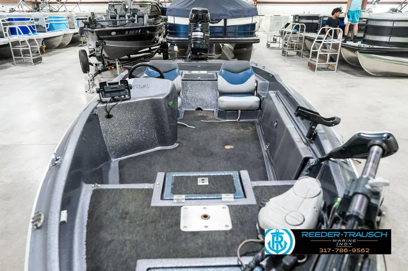 Slide: The Image of 1986 Phantom Panther boat interior in showroom, featuring seating and control panel. - 17