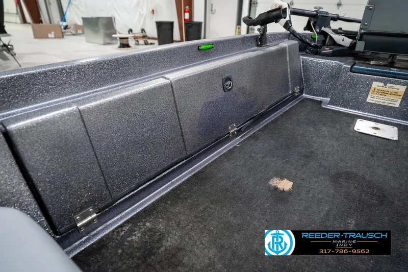 Slide: The Image of Interior of a 1986 Phantom Panther boat, featuring storage compartments and control panel. - 23