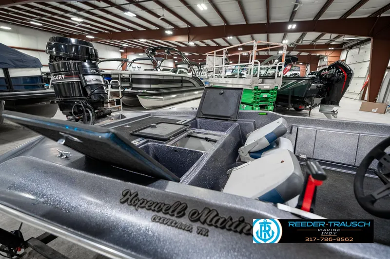 Slide: The Image of 1986 Phantom Panther boat interior with Mercury engine in a showroom. - 27