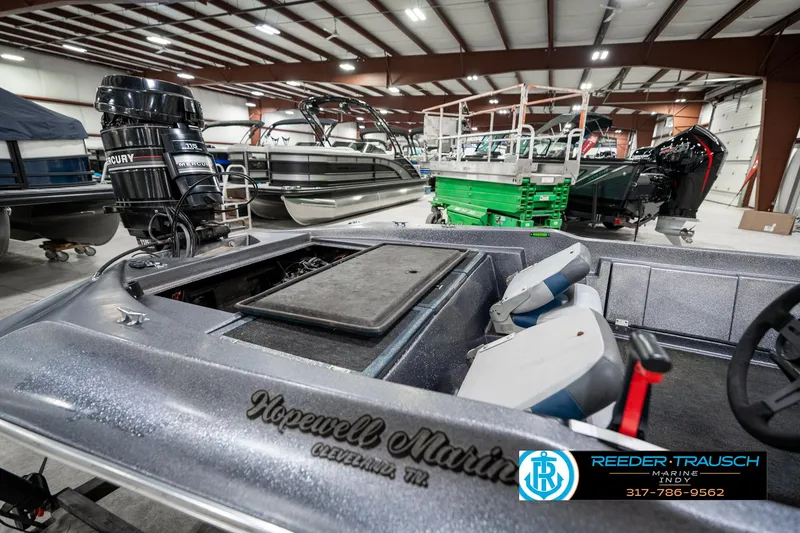 Slide: The Image of 1986 Phantom Panther boat with Mercury engine in a showroom, featuring Hopewell Marine branding. - 28