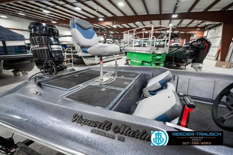Slide: The Image of 1986 Phantom Panther boat interior with Mercury engine in a showroom. - 29
