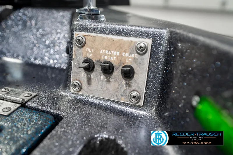 Slide: The Image of Control panel on a 1986 Phantom Panther boat with switches for tilt and aerator. - 36
