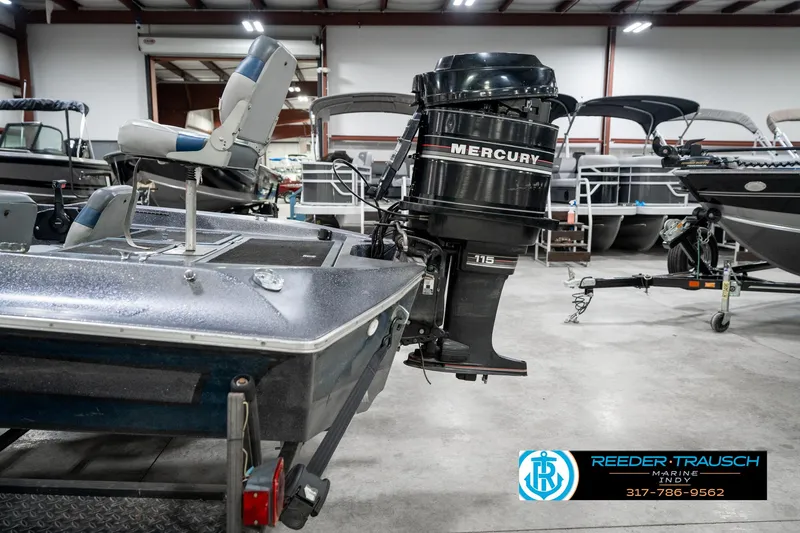 Slide: The Image of 1986 Phantom Panther boat with Mercury 115 outboard motor in showroom. - 37