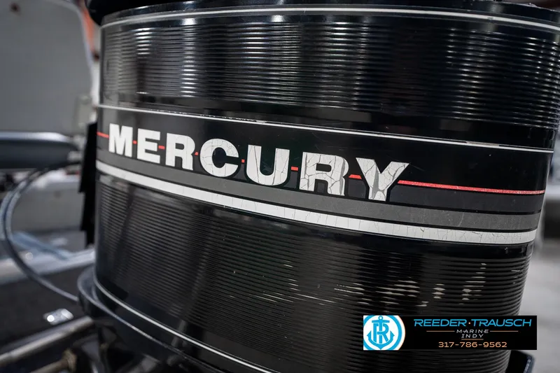 Slide: The Image of Vintage 1986 Mercury outboard motor, close-up view, featuring classic design elements. - 38