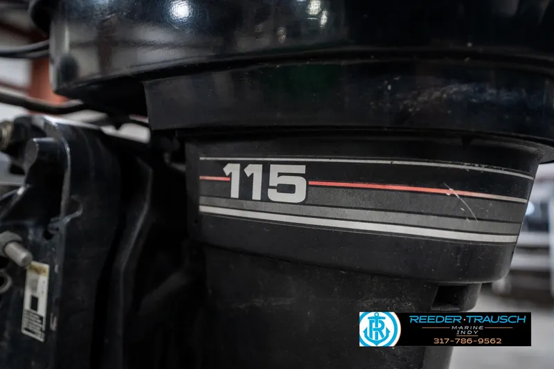 Slide: The Image of 1986 Phantom Panther outboard motor with "115" decal, Reeder-Trausch Marine logo visible. - 39