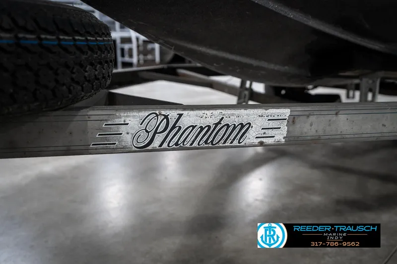 Slide: The Image of 1986 Phantom Panther trailer with logo, featuring Reeder Trausch Marine contact details. - 41