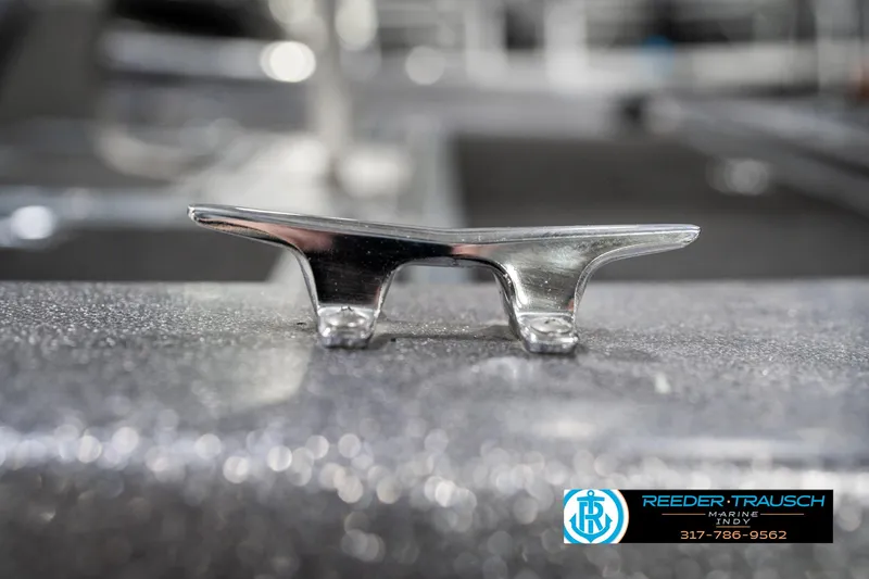 Slide: The Image of Chrome boat cleat on a 1986 Phantom Panther, with Reeder Trausch Marine logo. - 42