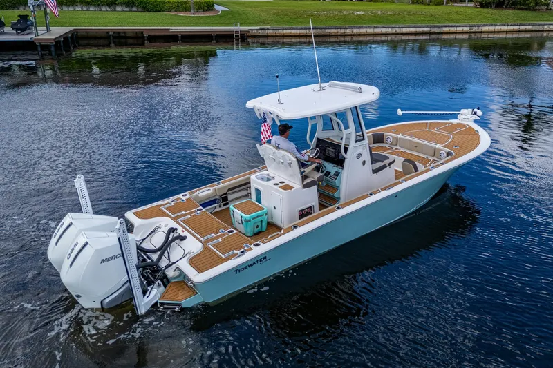 Slide: The Image of 2023 Tidewater 2700 Carolina Bay boat cruising on a calm waterway. - 11